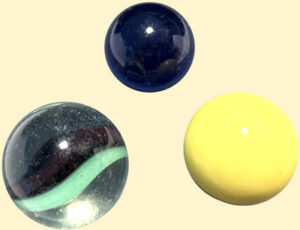 three mass-produced marbles
